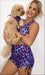 Girl wearing Pink Leopard set, holding her puppy in a matching Pink Leopard doggy bandana
