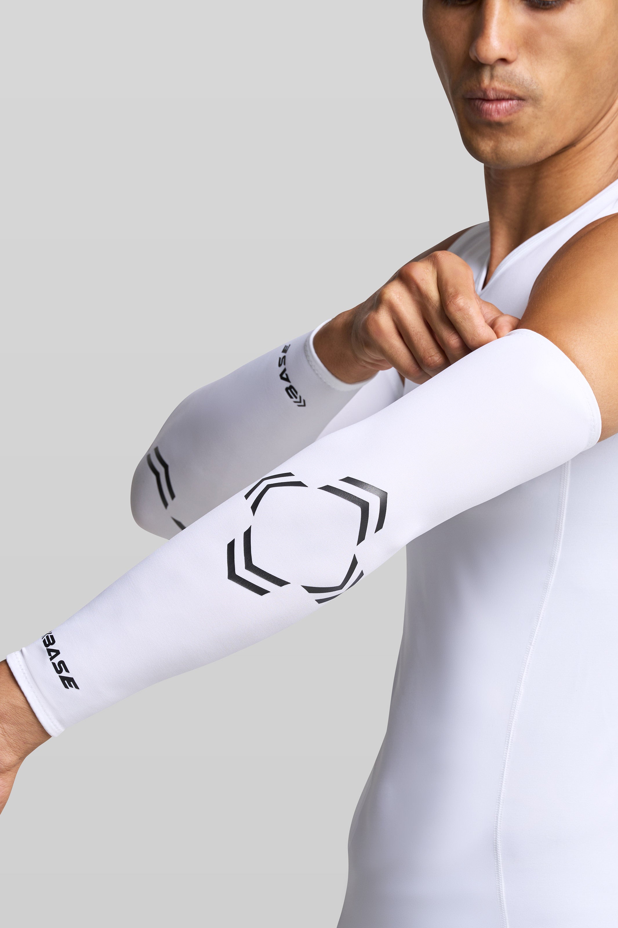 BASE Compression Arm Guard YOUTH-XS BASE Compression Arm Sleeve (Pair) - White